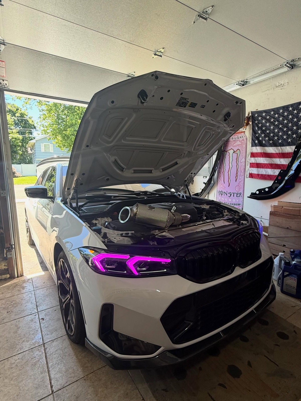 BMW with custom color DRL headlights — cosmetic mods